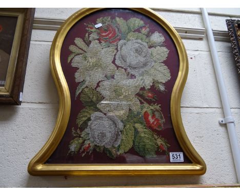 Vintage tapestry in a keyhole shaped glazed gilt frame