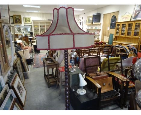 Victorian mahogany bobbin turned standard lamp and shade sitting on bun feet