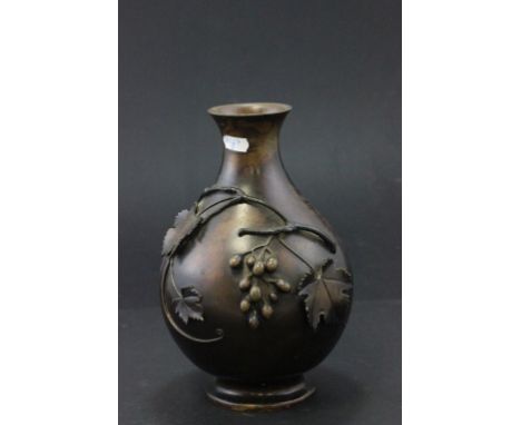 Vintage bronze vase decorated with grapevine