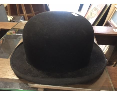 A Moores vintage bowler hat.