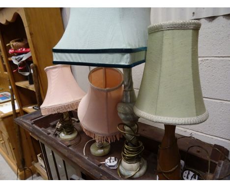 Three onyx pedestal table lamps and one wooden table lamp