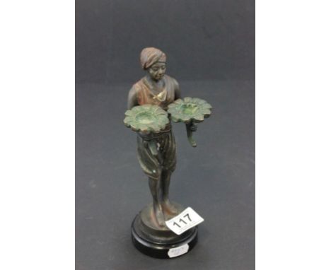 Bronze figure of a turbaned man carrying water lillies signed Bergmann