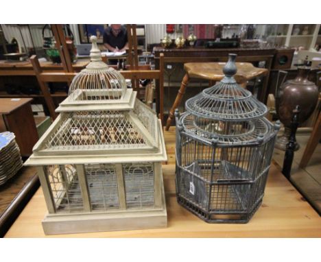 Two vintage wooden bird cages