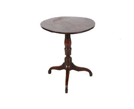 A 19th century tilt top table. The circular top mounted on a turned column with tripod supports, H67cm x Diameter 58cm