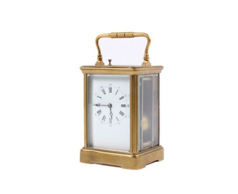 An early 20th century brass cased repeater carriage clock. The white enamel dial with Roman hours and Arabic minutes, the mov