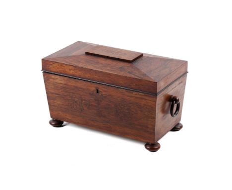 A 20th century rosewood tea caddy. Of sarcophagus form, having inlaid details to the top, a pair of turned wooden side handle