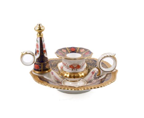 A Royal Crown Derby candlestick holder and snuffer. In the 'Old Imari' pattern, printed in red to the base and numbered '1128