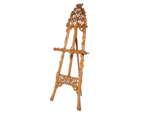A Victorian acorn and leaf decorated carved wooden artist's picture easel. Of tripod form. H199cm