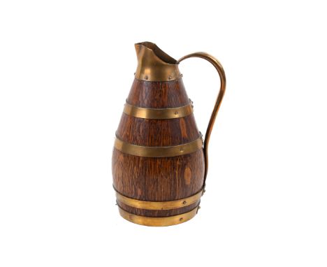 A circa 1933 Gerard Lafitte oak pitcher. Having brass banding and handles, impressed marks and date to the rim, 22.5cm high