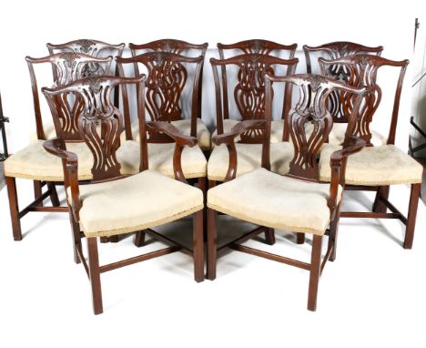 A set of ten Chippendale style mahogany chairs. Comprising two carvers and eight dining chairs, having carved slats and scrol