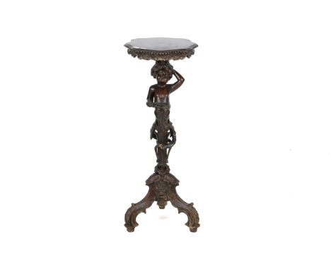An Italian carved cherub stand. Circa 1850, raised on a tripod base. H89cm