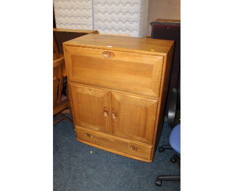 A VINTAGE ERCOL ELM AND BEECH DRINKS CABINET