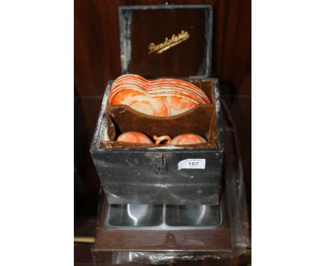 A CASED SET OF BANDALASTA BAKELITE CUPS & SAUCERS PLUS A SERVING SET