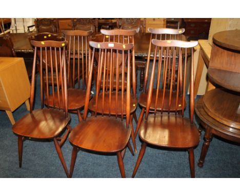 A SET OF SIX ERCOL DARK STICK BACK DINING CHAIRS