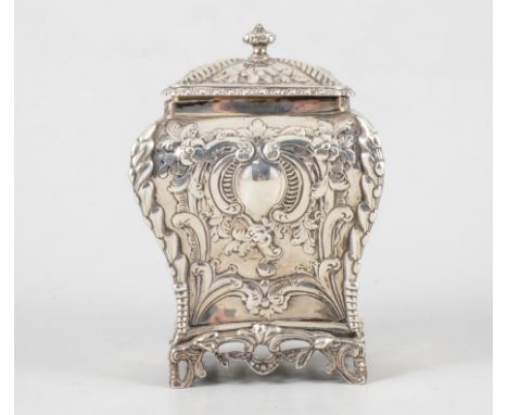 A George III style silver tea caddy, bombe form with repousse chased floral and foliate swags,beaded flutes, vacant cartouche