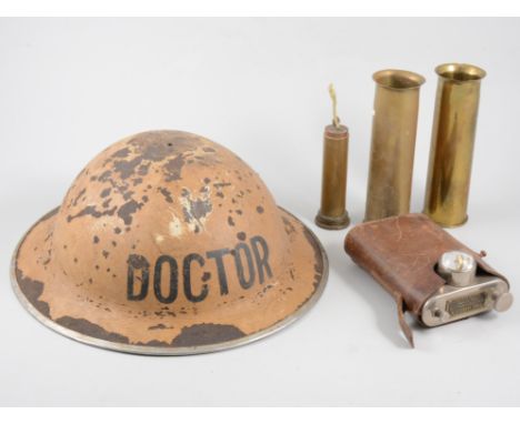 Tin helmet, lamp and shell cases.