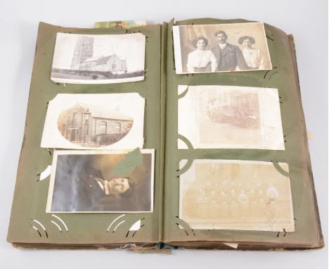 Postcard album, containing many photographic cards, mostly Nottinghamshire; together with portrait photographs and World War 