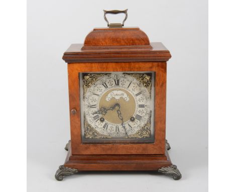 A walnut cased bracket clock, square dial with cast spandrel, signed Prescott, the movement striking on a bell, 26cm.