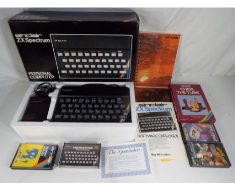 Sinclair - a ZX Spectrum personal computer in original box with some games, software catalogue and basic programming manual, 