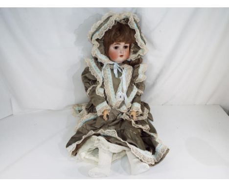 Dolls - a German bisque headed jointed dressed doll, approx 80cm (h) with glass sleeping eyes, open mouth with ceramic teeth,