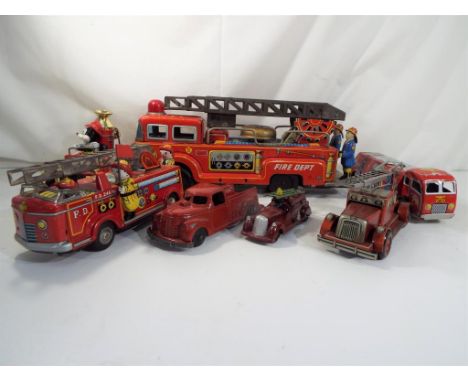 Metalcraft, Timpo and others - five tin-plate fire engines, three friction powered plus two others, a Timpo diecast fire engi