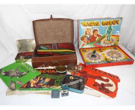 Meccano - A vintage leather case containing a quantity of vintage Meccano with ephemera relating to Meccano accessory outfit 