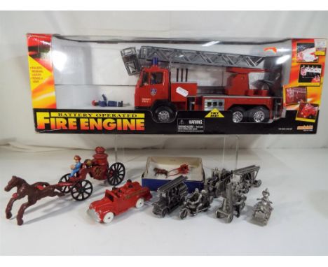 A large battery operated fire engine with sound and lights by Everbright, six pewter fire engines and three others, condition