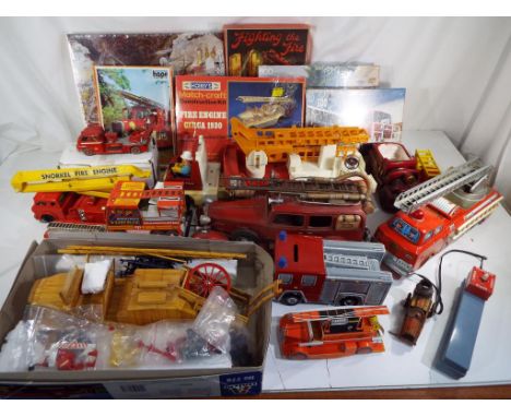 Fire Engines - A good selection of plastic, tinplate and ceramic fire related vehicles, also included in the lot are two Hobb