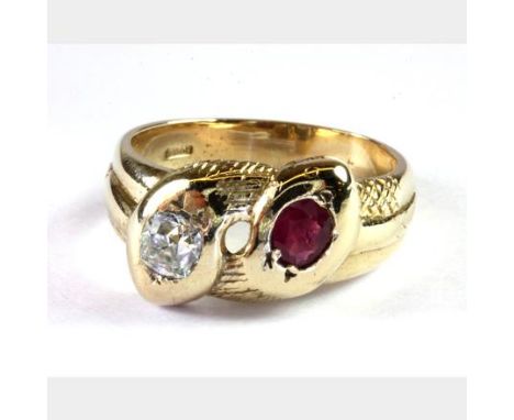 A gentleman's yellow metal (tested high carat gold) double snake ring set with an old cut ruby and diamond, (R.5).