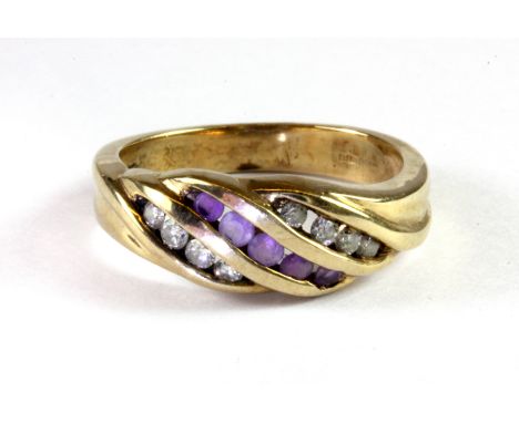 A 9ct yellow gold (stamped 9k) diamond and amethyst set ring, (N).