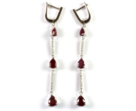 A pair of 925 silver ruby and white stone set drop earrings, L. 7cm.
