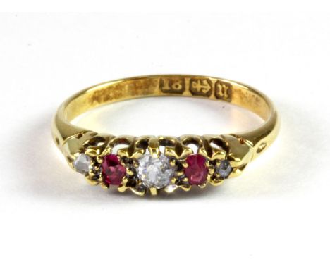 An 18ct yellow gold ruby and diamond set ring, (K).