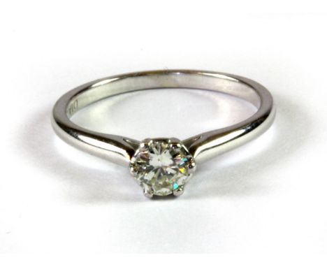 A 9ct white gold solitaire ring set with a brilliant cut diamond, (K).