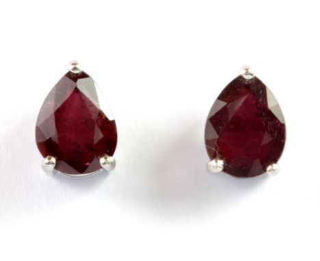 A pair of 925 silver mounted pear cut ruby set stud earrings, L. 1cm.