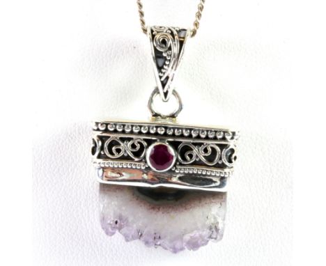 A 925 silver pendant and chain set with an amethyst crystal and a ruby.