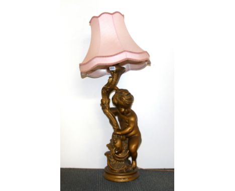A large vintage gilt plaster cherub table lamp and shade, H. 95cm.