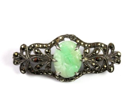 A 925 silver and marcasite brooch set with carved jade, L. 4.6cm.