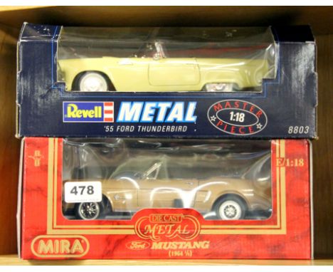 Two large scale diecast model cars.