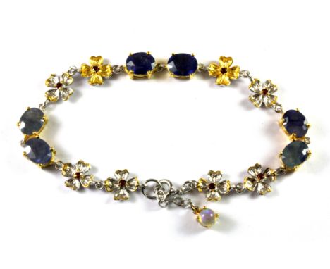 A Hana Maae 925 silver gilt bracelet set with sapphires, garnets and an opal, L. 18cm.