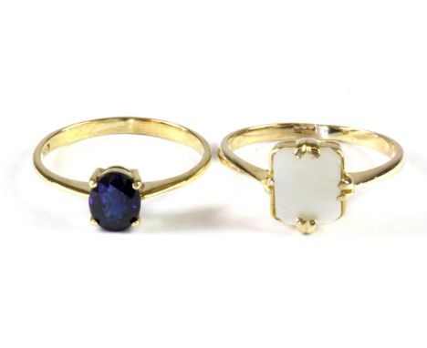 A 14ct yellow gold (stamped 585) sapphire set ring, (K.) and a 9ct yellow gold mother of pearl set ring, (L).