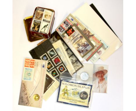 A quantity of first day cover stamps and coin sets etc.