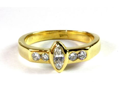 An 18ct yellow gold ring set with marquise and brilliant cut diamonds, (K.5).