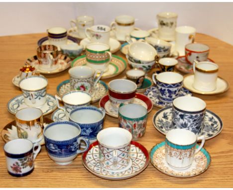 A quantity of collectors cups and saucers.