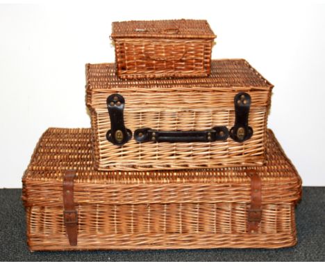 Three vintage cane baskets, largest 68 x 43 x 20.