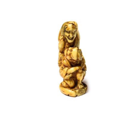 A Japanese ivory netsuke, 19th century, two figures seated