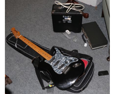 A Fender amp; a Manhattan electric guitar; and an oboe in soft case  