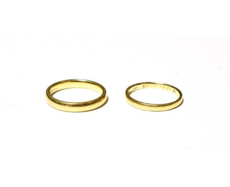 An 18 carat gold band ring, finger size M; and another band ring, marks rubbed, finger size L.  18 carat gold ring - 4.0 gram