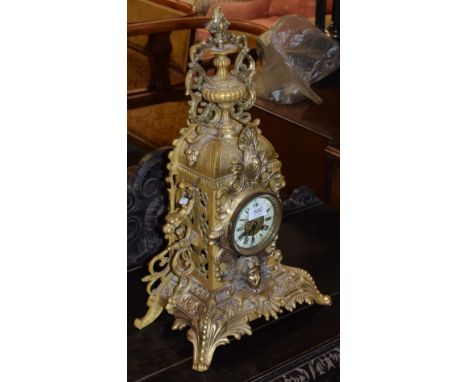 A gilt metal striking mantel clock 