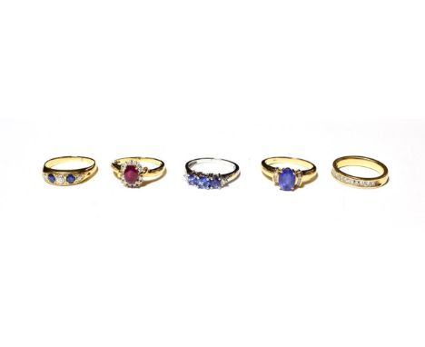 An 18 carat gold diamond half hoop ring, finger size L1/2; a sapphire and diamond five stone ring, stamped '18CT', finger siz