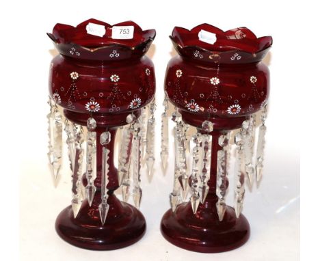 A pair of ruby glass table lustres, circa 1890, with castellated rim, painted foliate bands and prismatic drops, 34cm